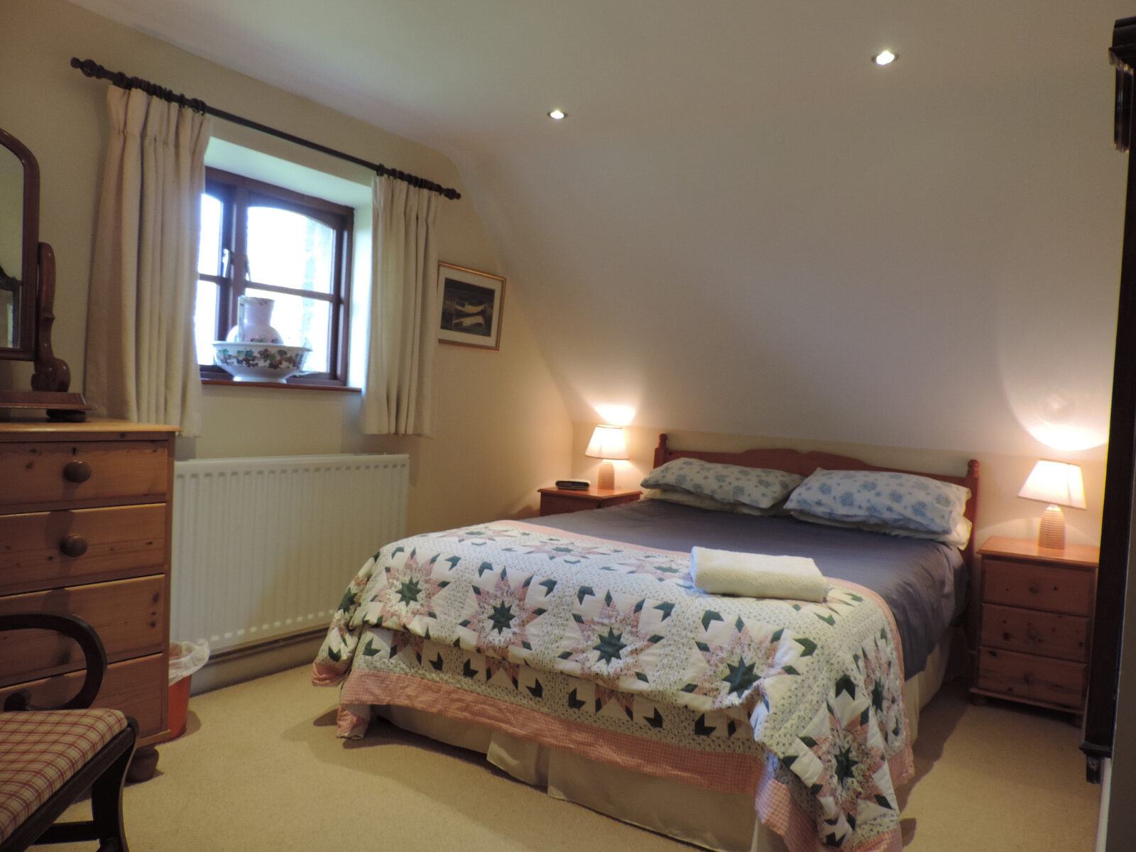 The main double bedroom in Geranium Cottage