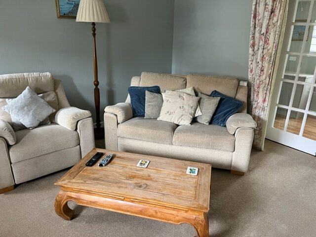 The comfortable sitting room in Honeysuckle Cottage
